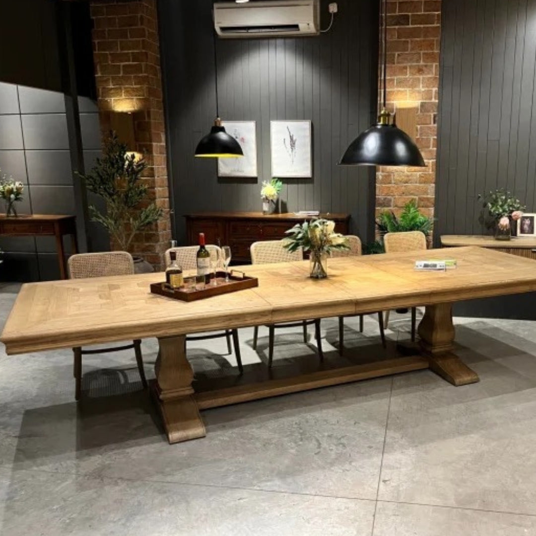 Wooden dining table with chairs in a modern dining room setting.