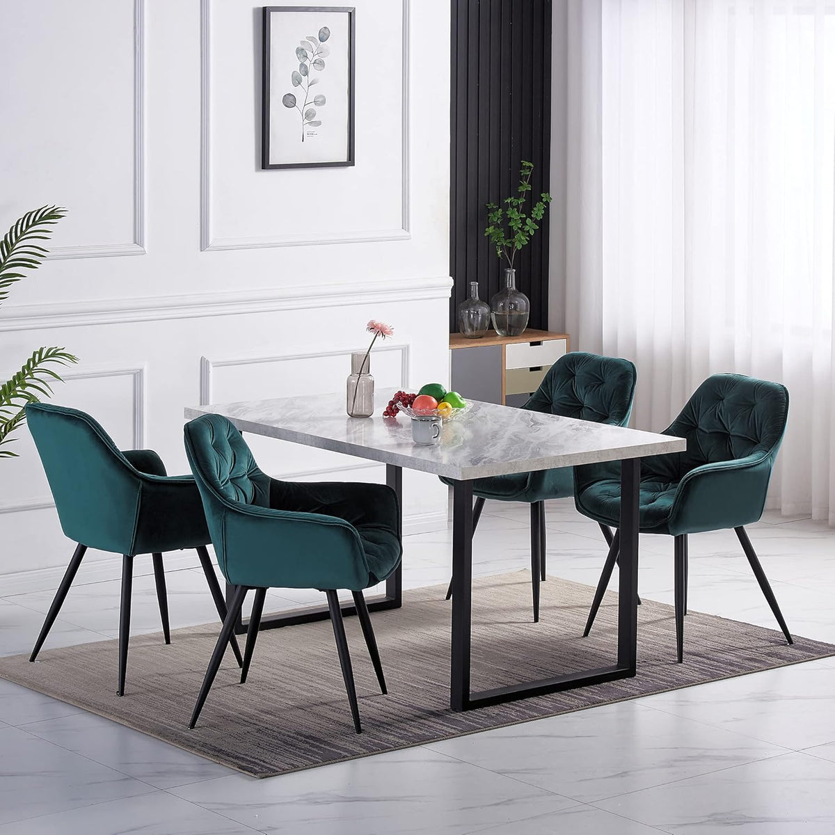 Dining room with a marble table and teal chairs in a modern interior setting.