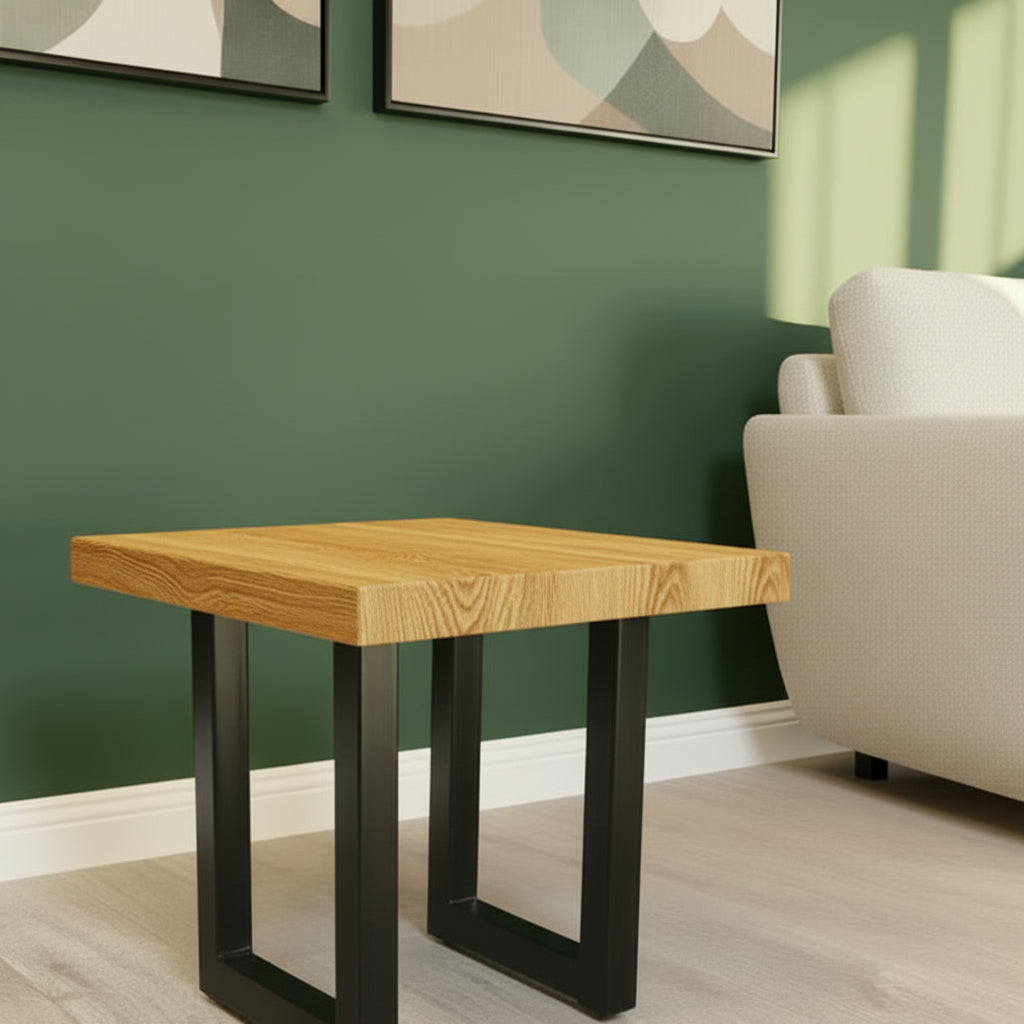 Ash Wooden side table with black metal legs against a neutral wall.