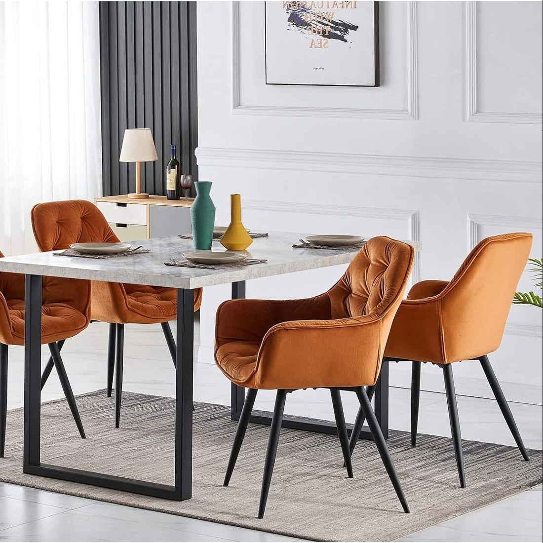 Dining room with a marble table and brown chairs in a modern interior setting.