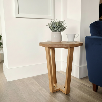 Wooden side table with decorative items in a living room setting