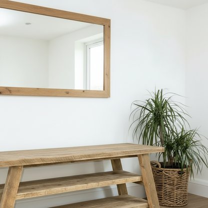 Wooden TV stand with a television in a living room setting.